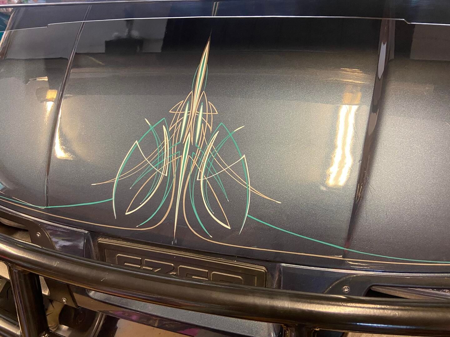 Free Hand Pinstriping on a vintage air cleaner by Clint Perkins from Lafayette Indiana 47903